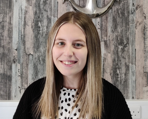 Megan stands in HR Anchor Office
