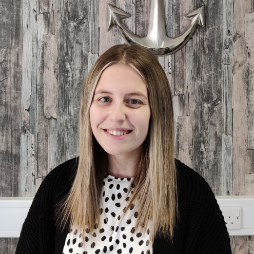 Megan stands in HR Anchor Office